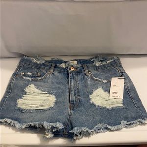 Distressed high-rise denim shorts